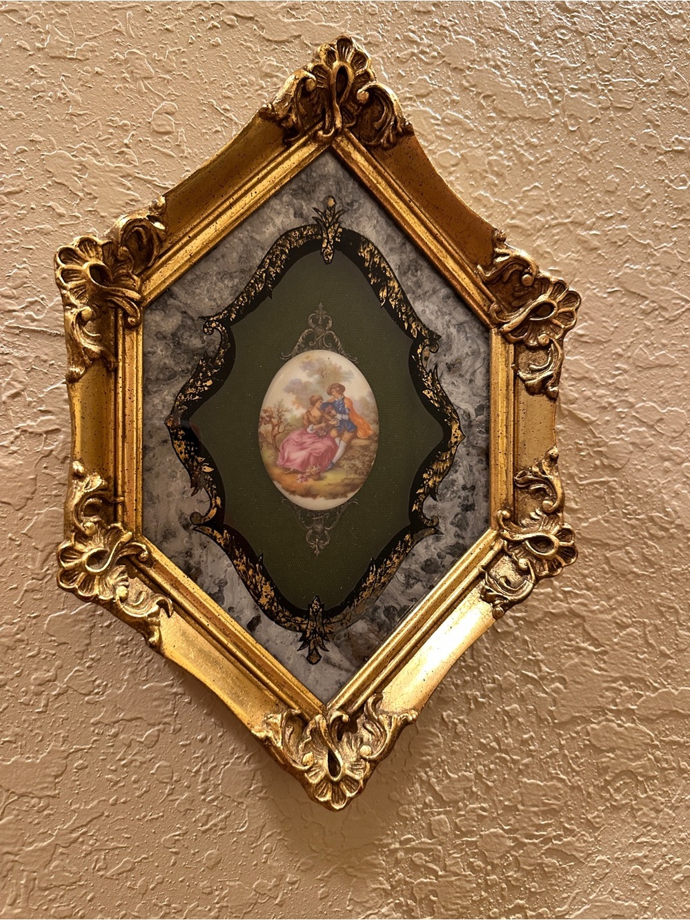 This is a vintage decorative wall plaque featuring a classical Fragonard-style